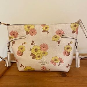 Coach bag light pink background color.